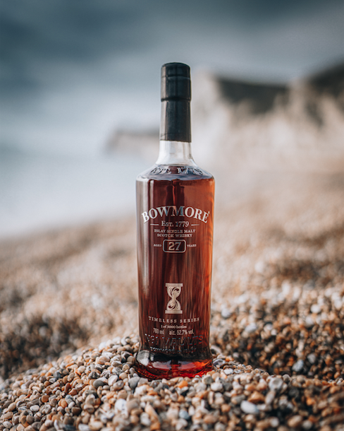 Bowmore 27 bottle on beach