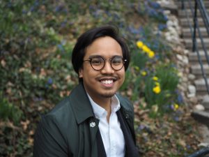 Photo of Phil De Luna smiling at the camera.