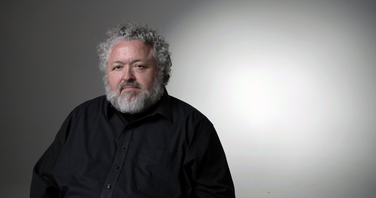 Designer Bruce Mau sits for a potrait in a black shirt