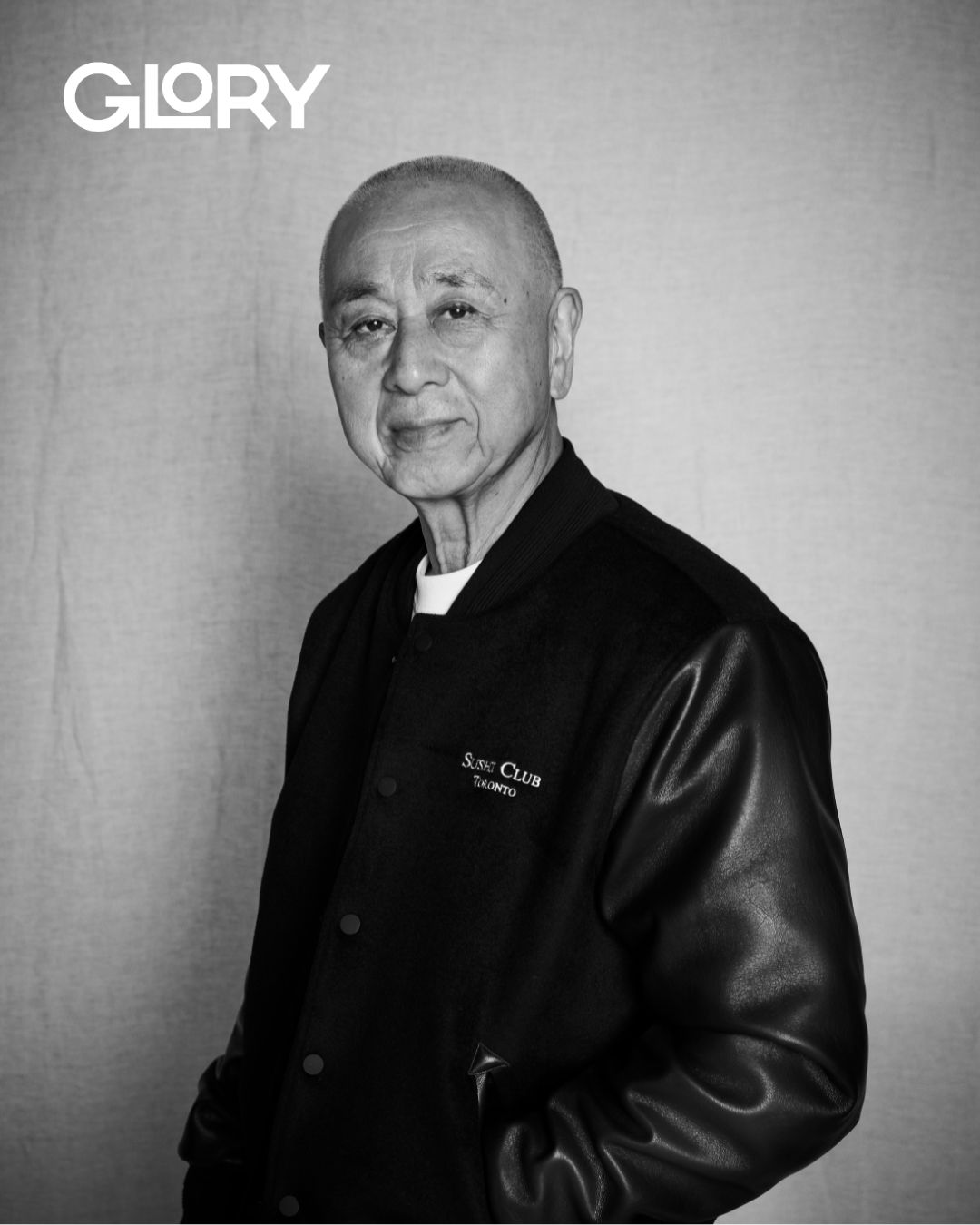 Nobu Matsuhisa wearing a black leather jacket in black and white.