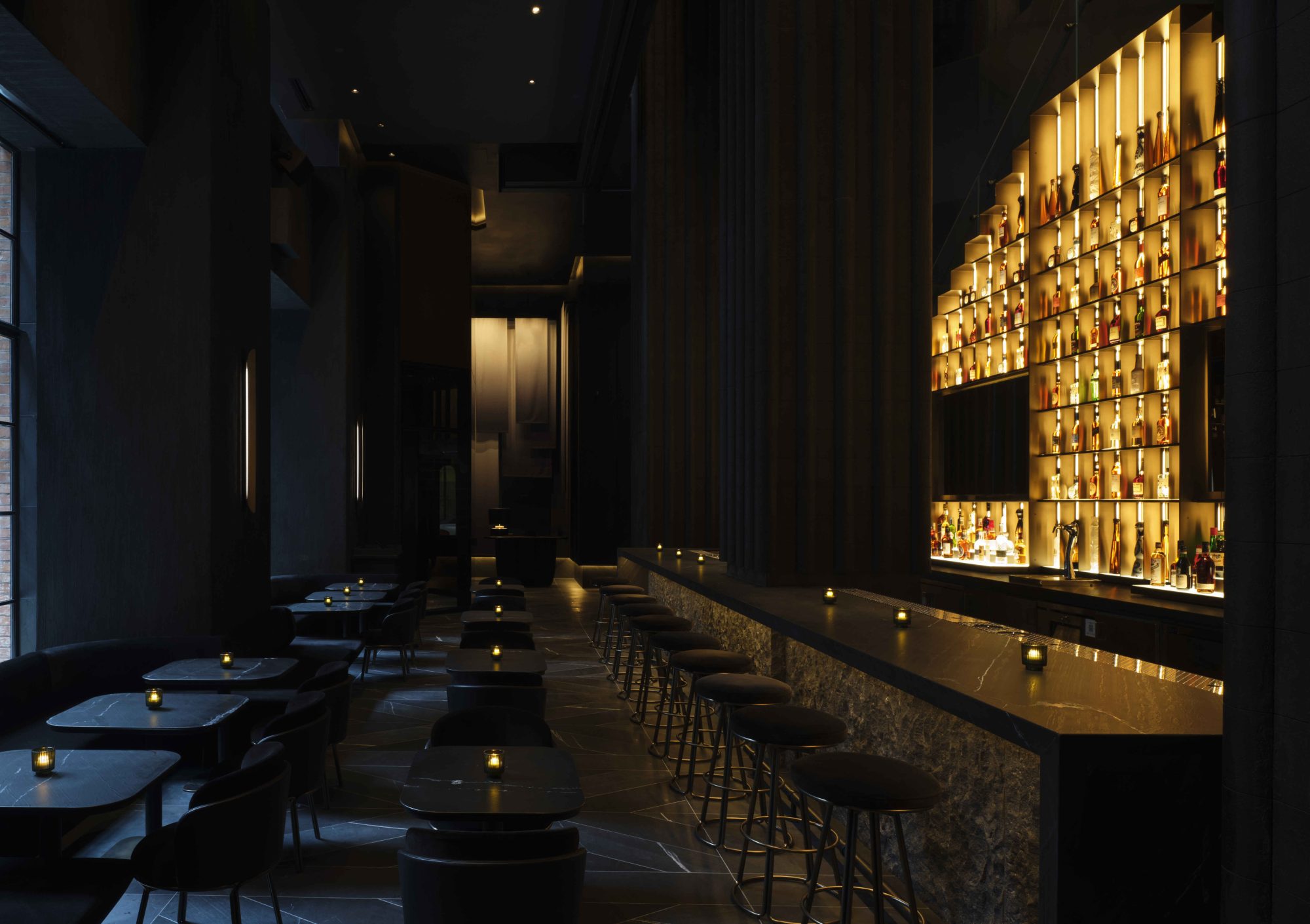 Dark bar setting with a lit backbar.