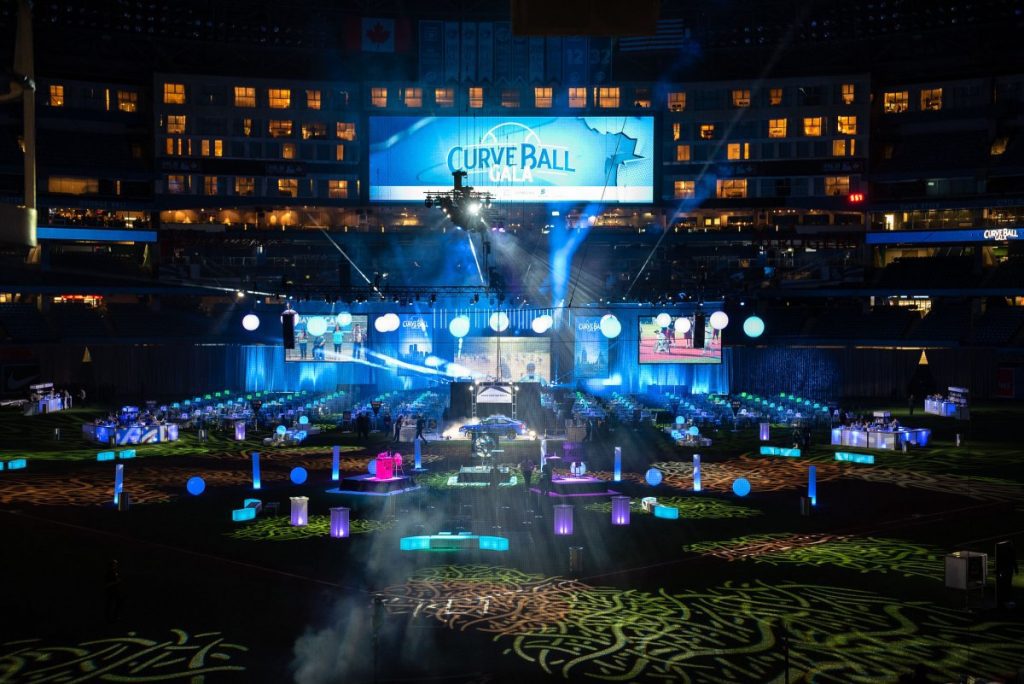 Photo of elaborate event set up on a baseball diamond created by CANDICE&ALISON