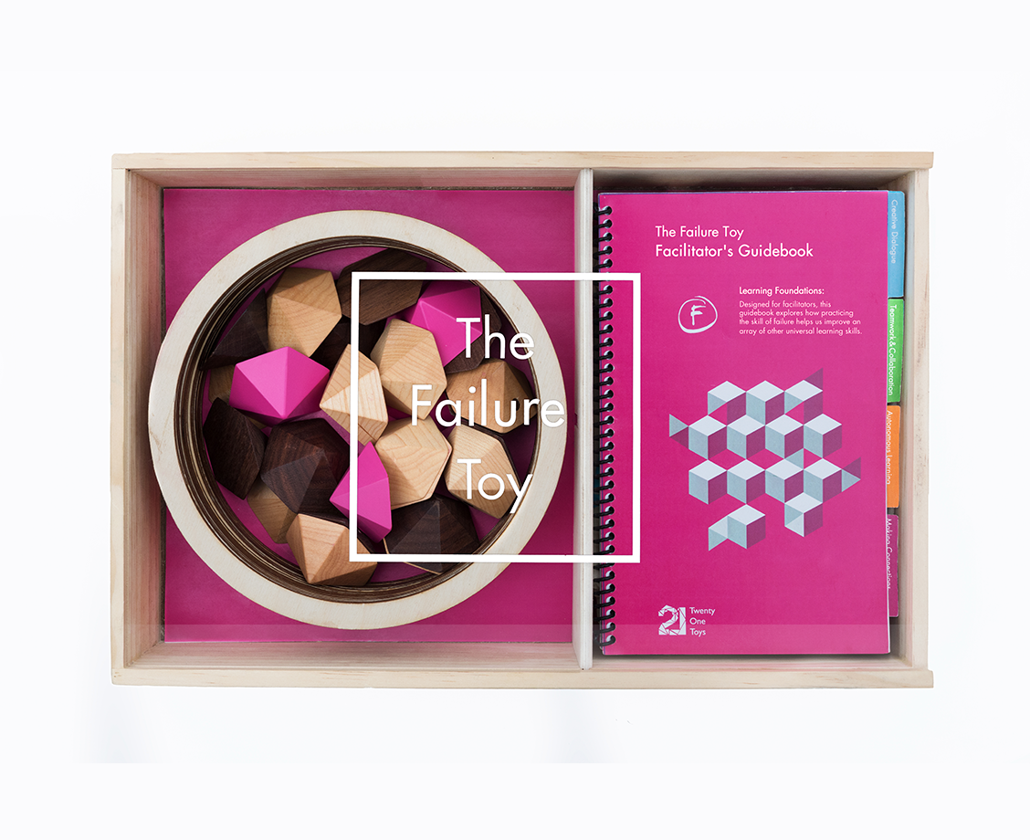 Twenty One Toys Failure Toy packaging with wood blocks