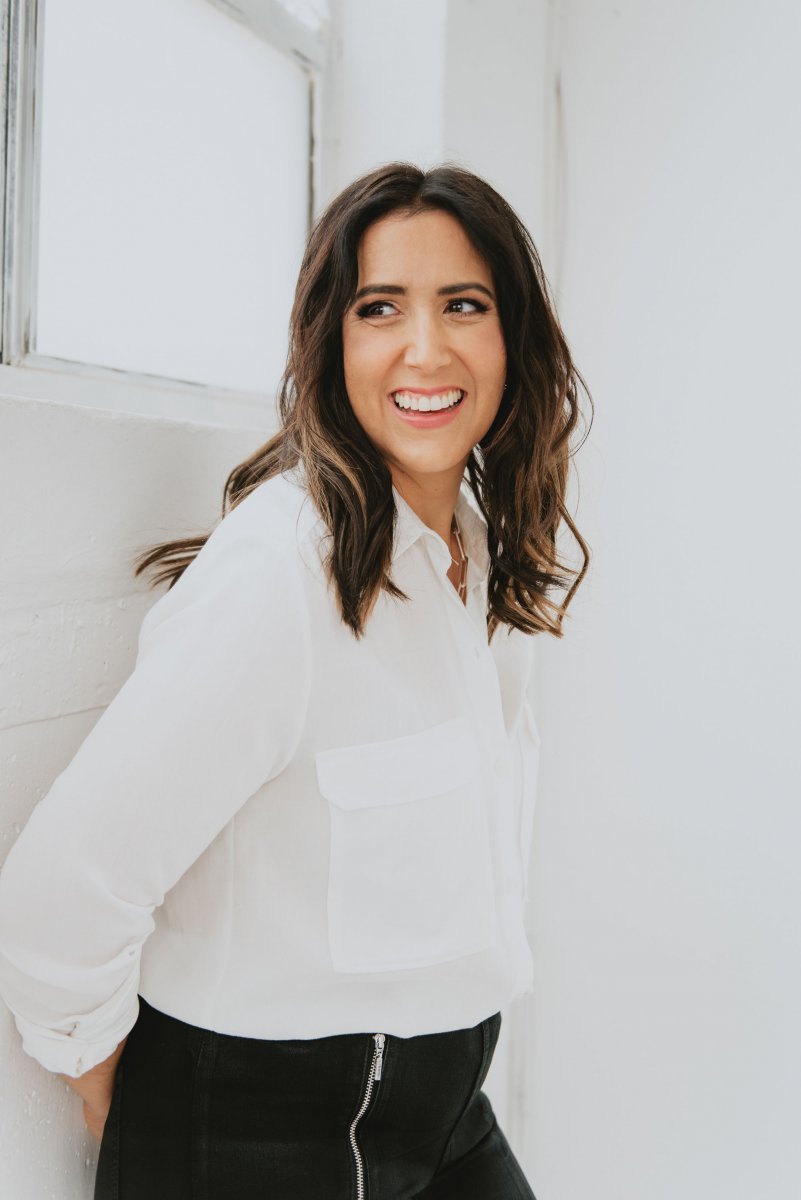 Woman in white blouse and black pants