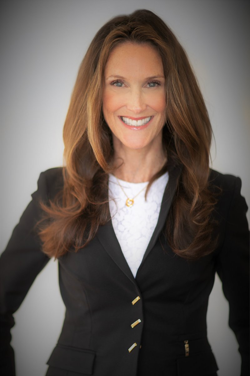 Jacqueline Ryan in black blazer and white shirt