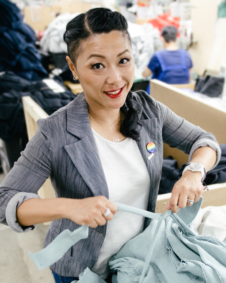 Woman in blazer holding fabric