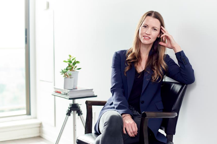 Meghan Roach sitting in office chair