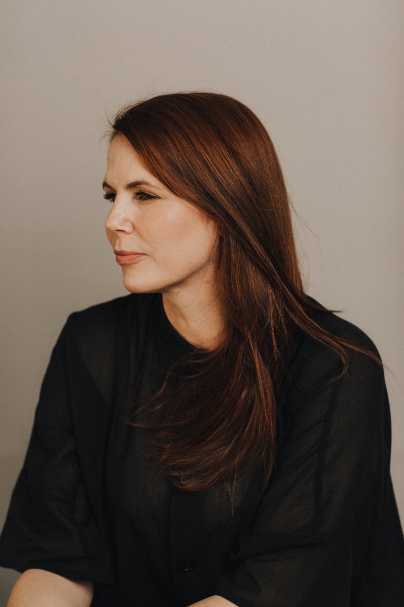 Woman with red hair looking to the side
